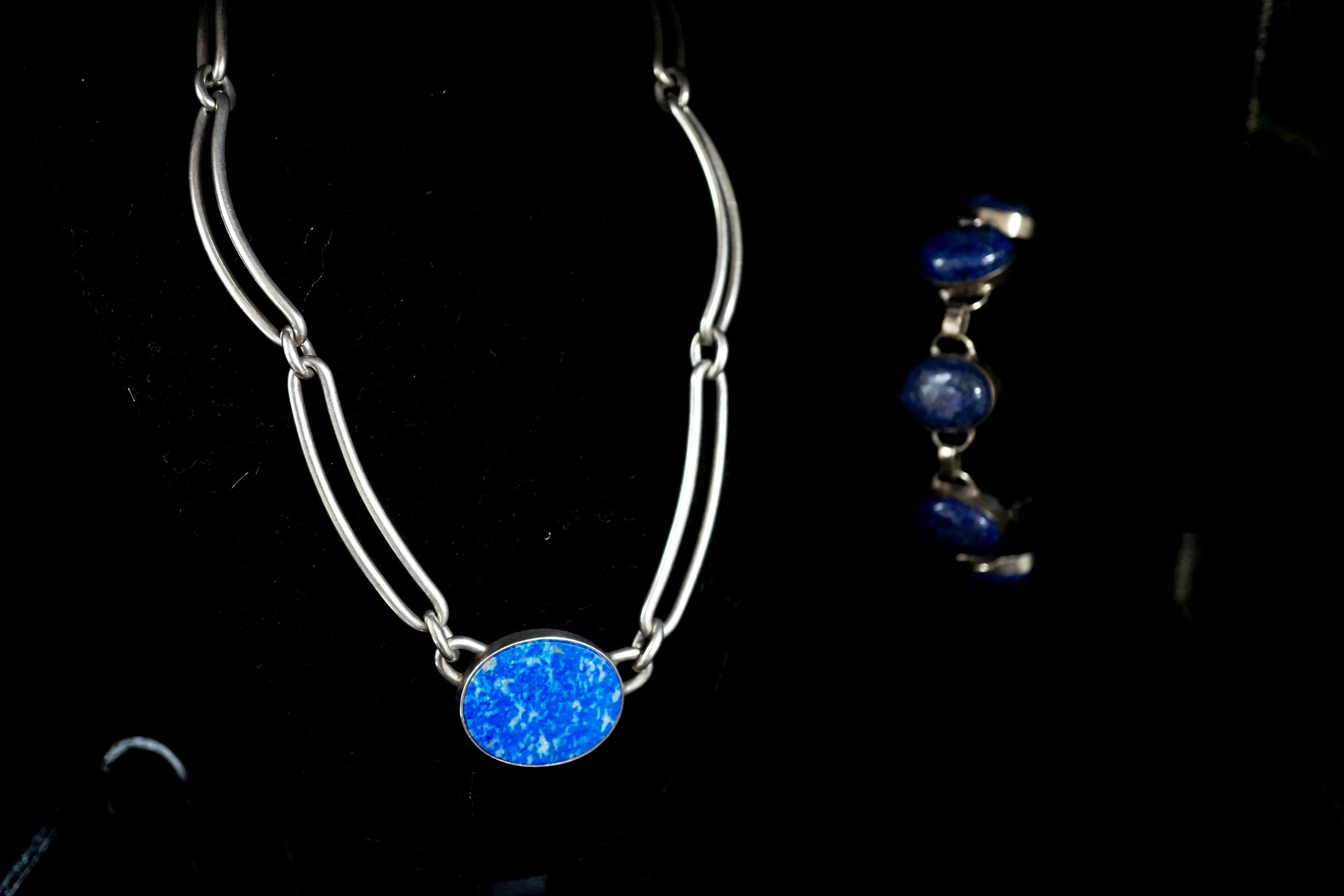 A 1980's Danish sterling 925 and lapis lazuli set necklace by N.E. From, 38cm and a white metal and lapis lazuli set bracelet.